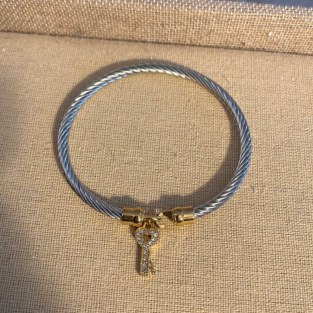 NWOT bracelet with a heart key charm
